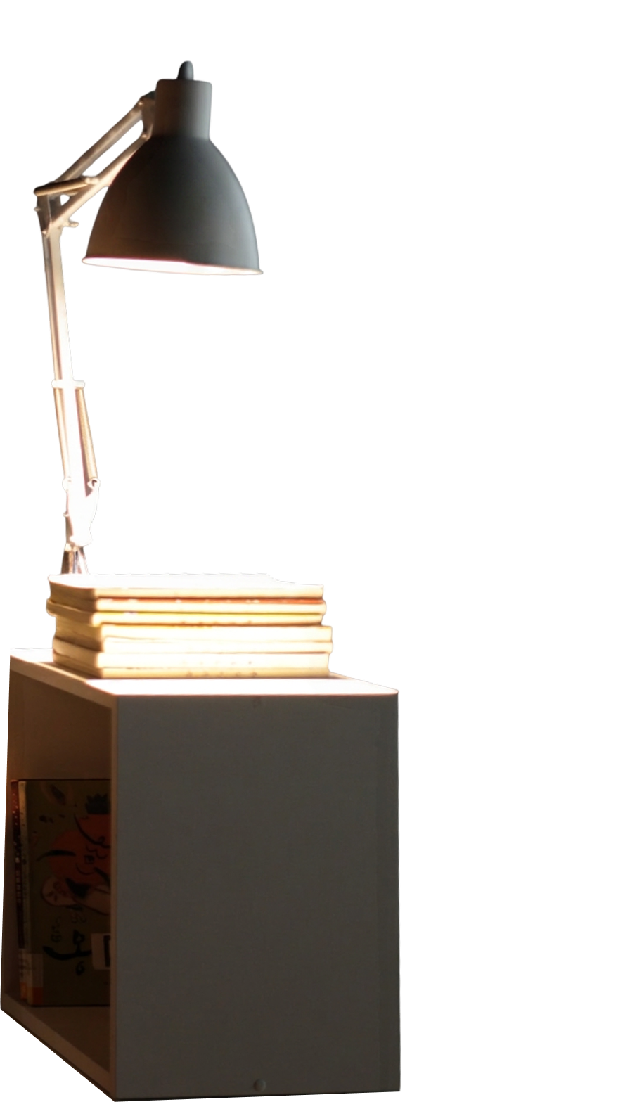 Desk lamp on a stack of books